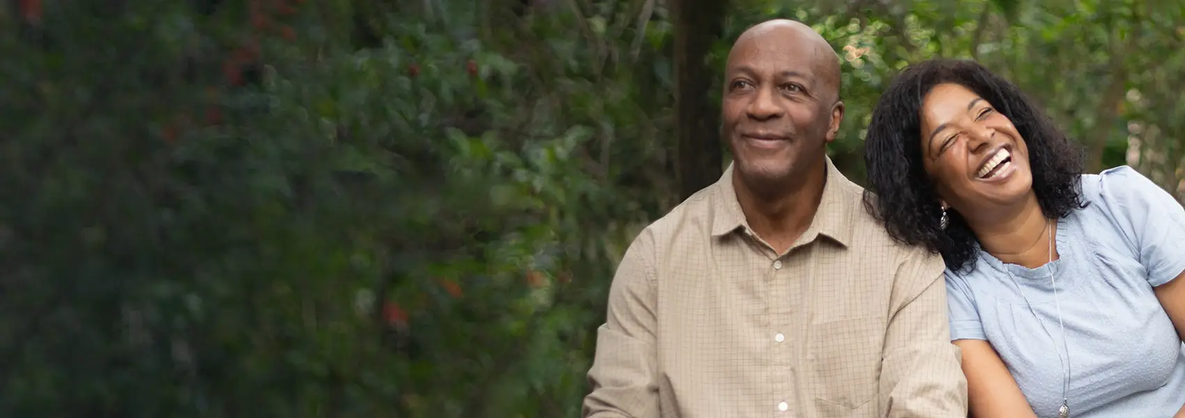 Couple outdoor sitting on a bench