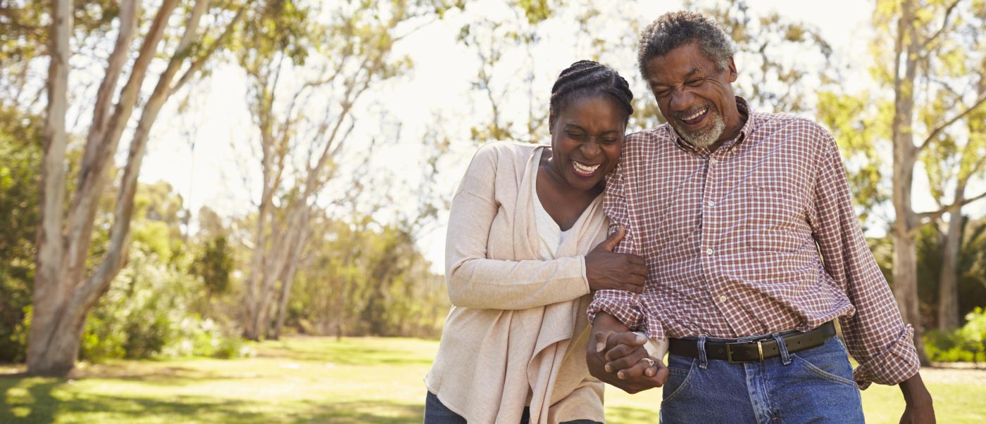 Couple laughing while on a walk